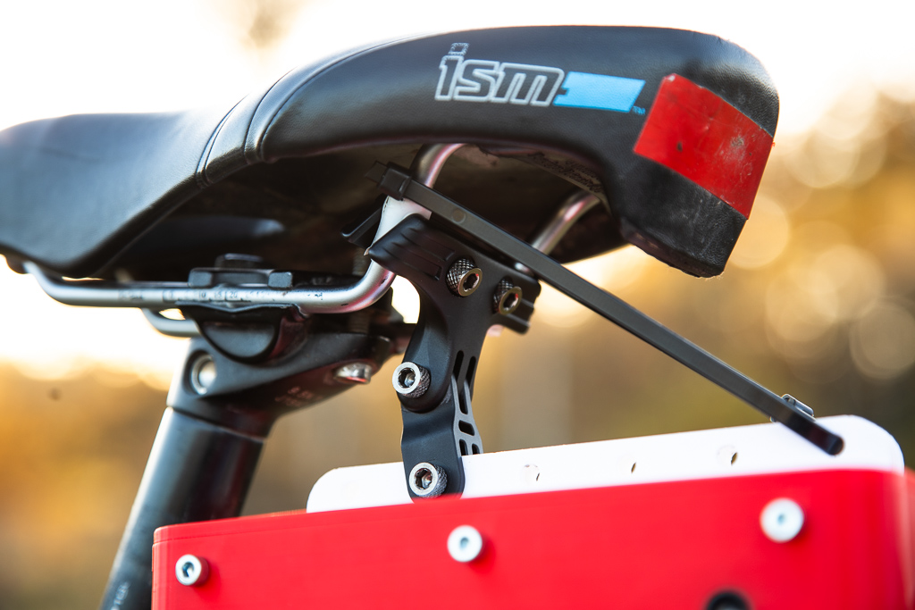 Device attached to seat rails