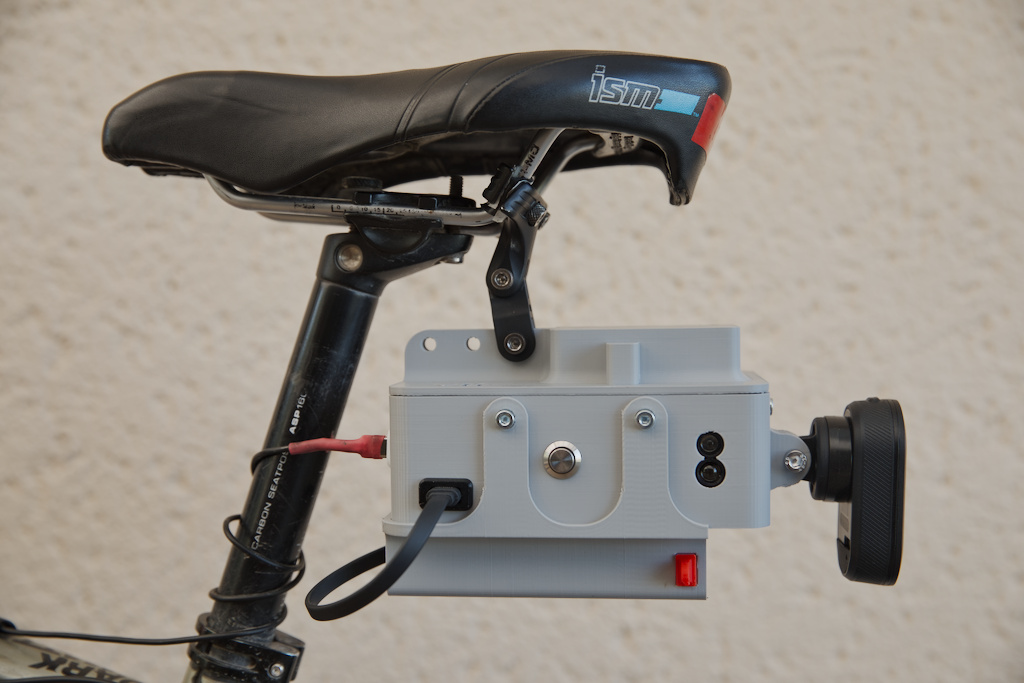 Device attached to seat rails