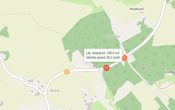 A screenshot of a map with overtaking events marked by colour (latera clearance) and size (vehicle speed)